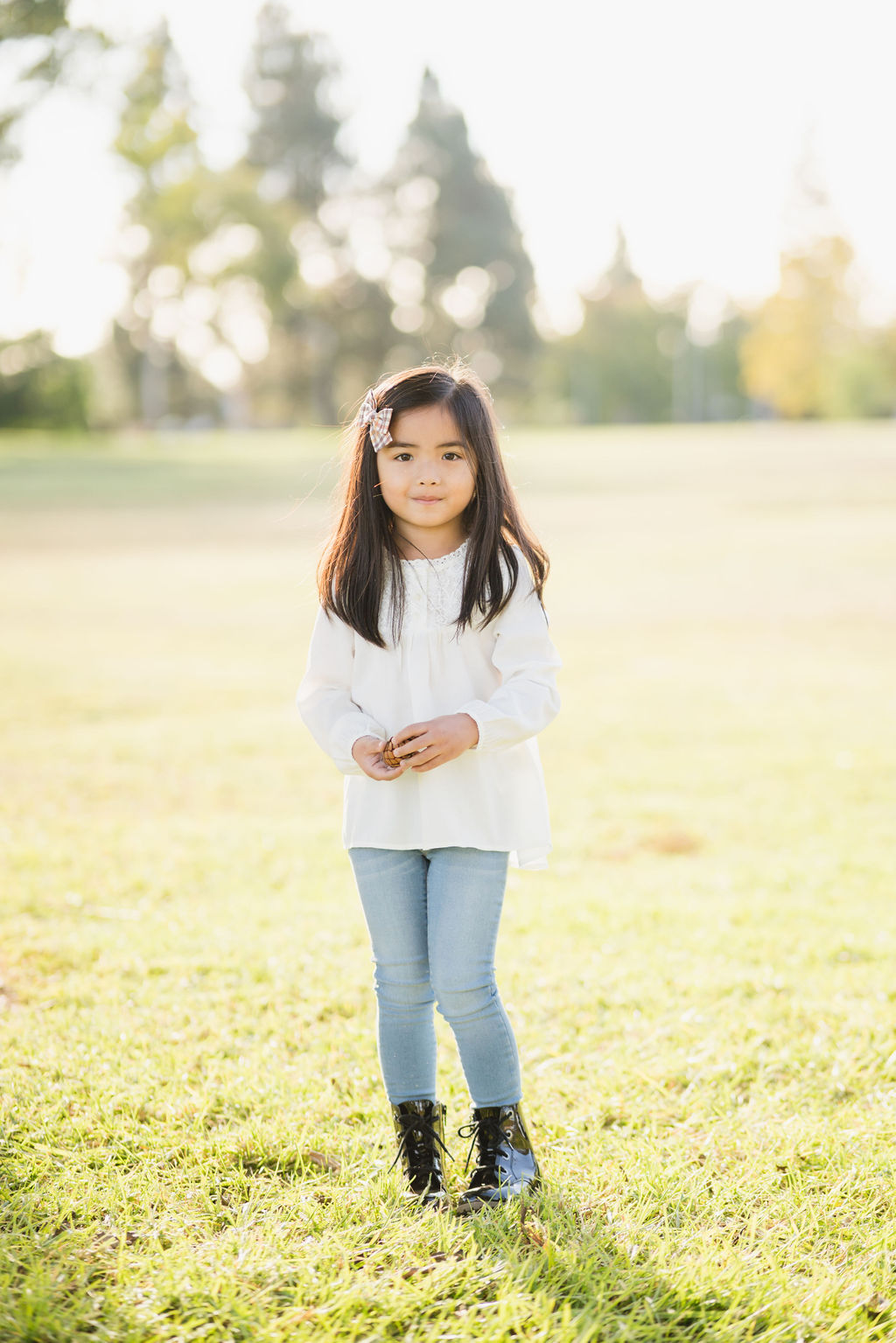 young girl on grassy field