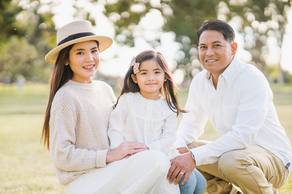 family smiling at the camera